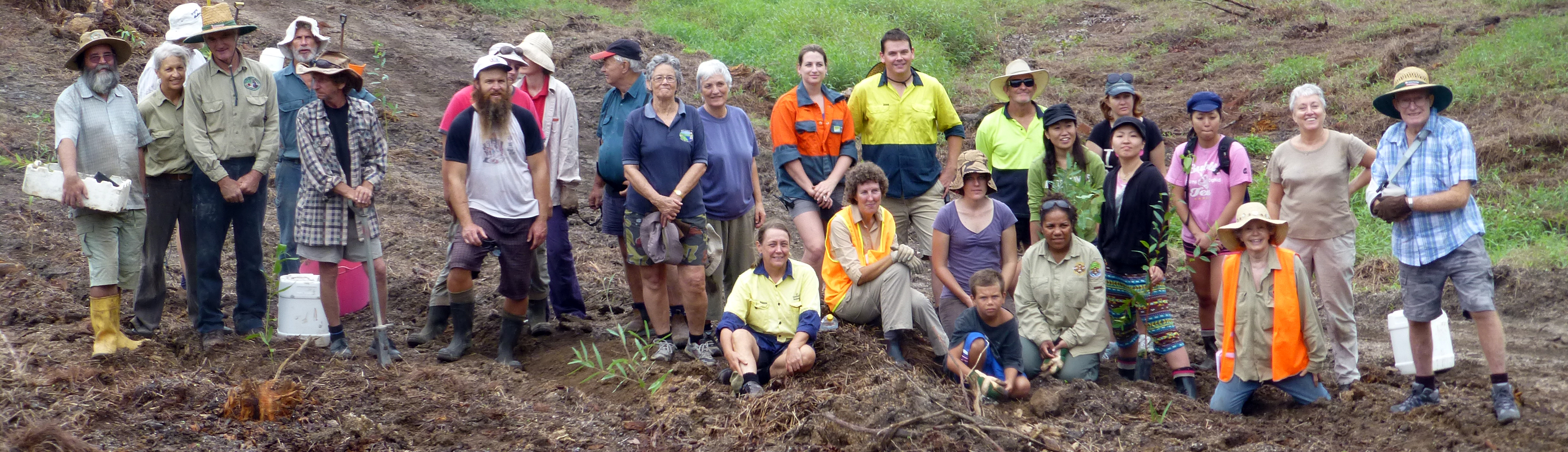 Suzie (seated) front and centre at a mahogany glider corridor re-planting  after the devastation of  Cyclone Yasi in 2011.